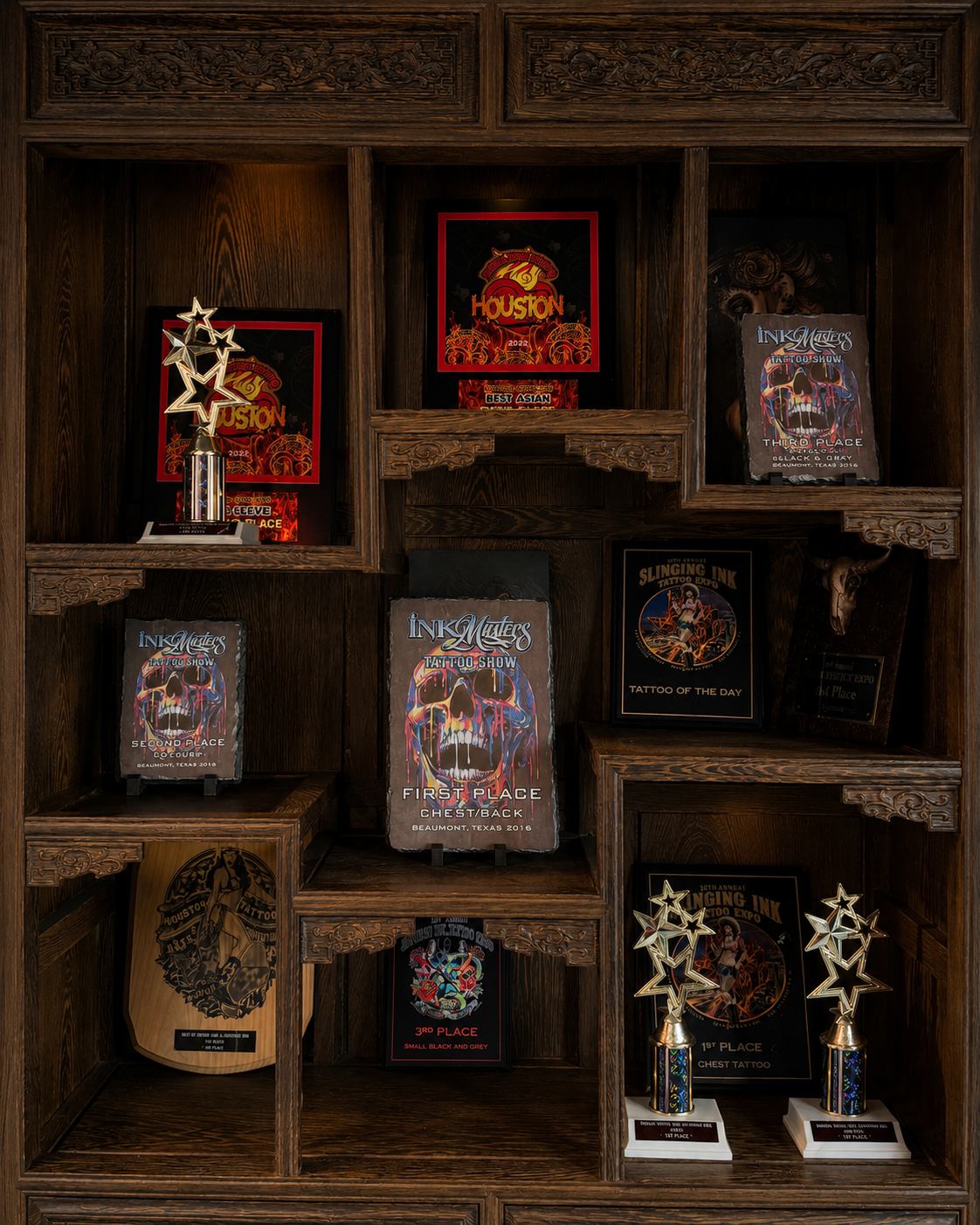 Tattoo convention awards and certificates from Peng Yang's international tattoo career